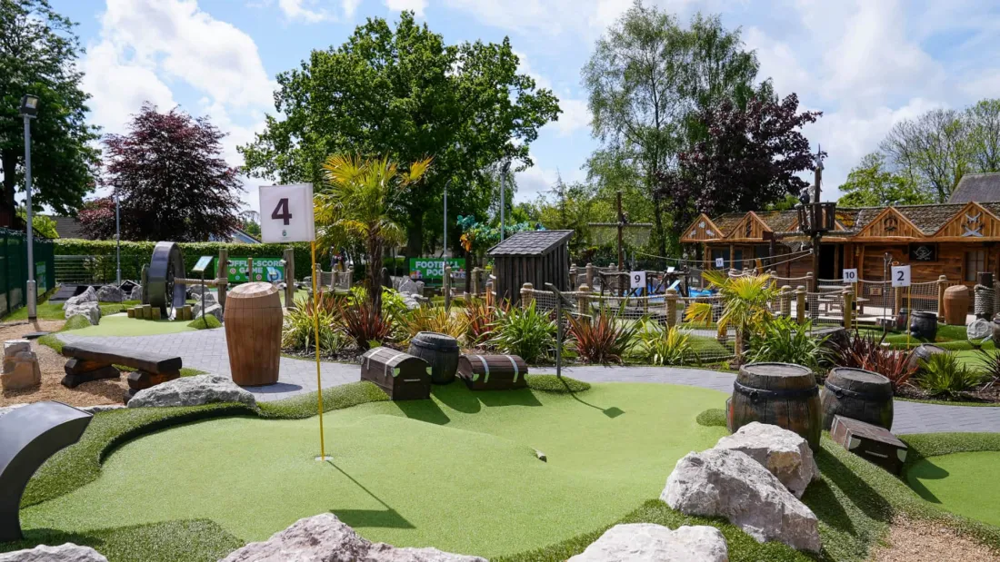 Garden and lawn surrounded by greenery